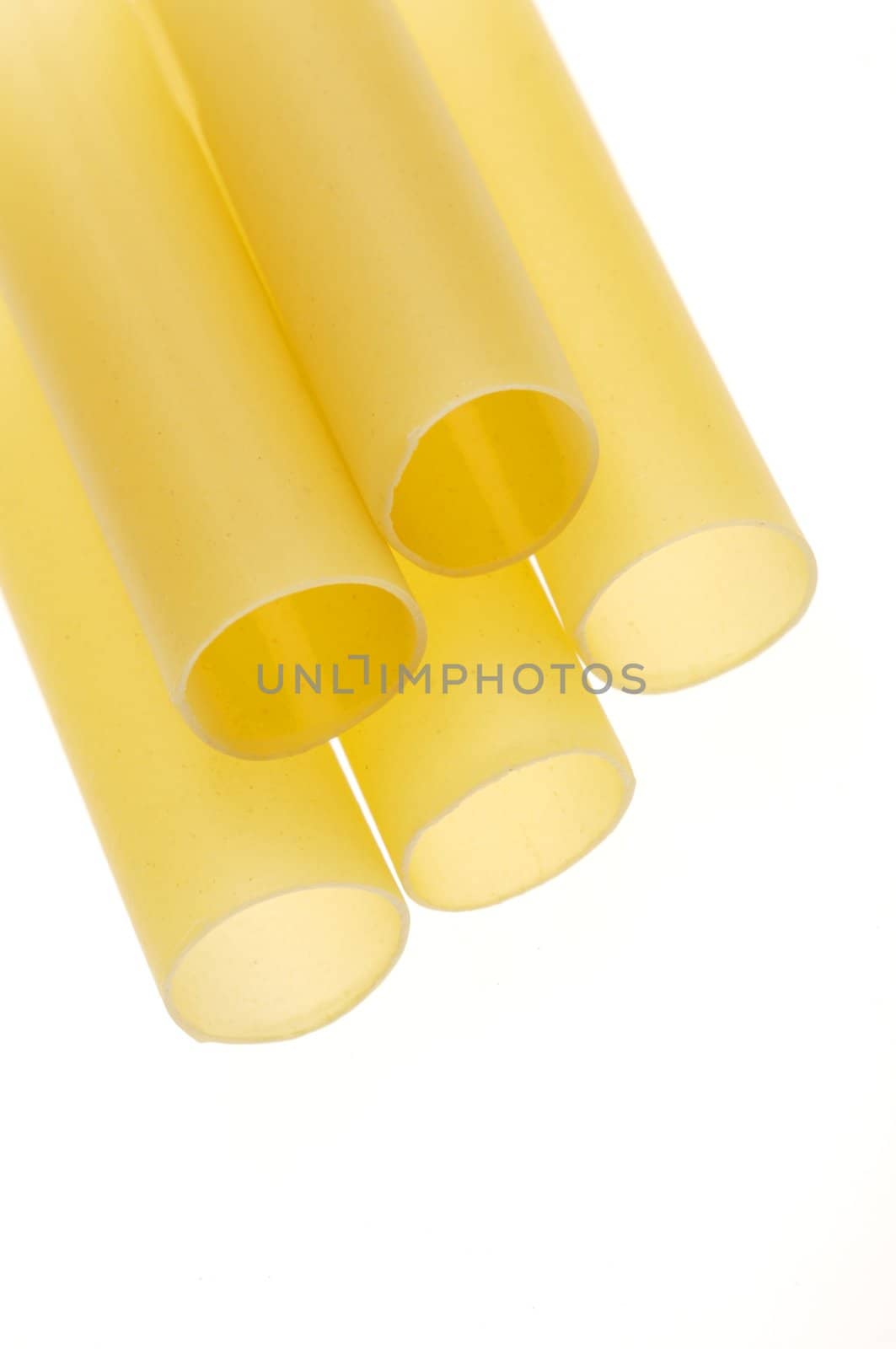 close up of dry canneloni pasta isolated on white background
