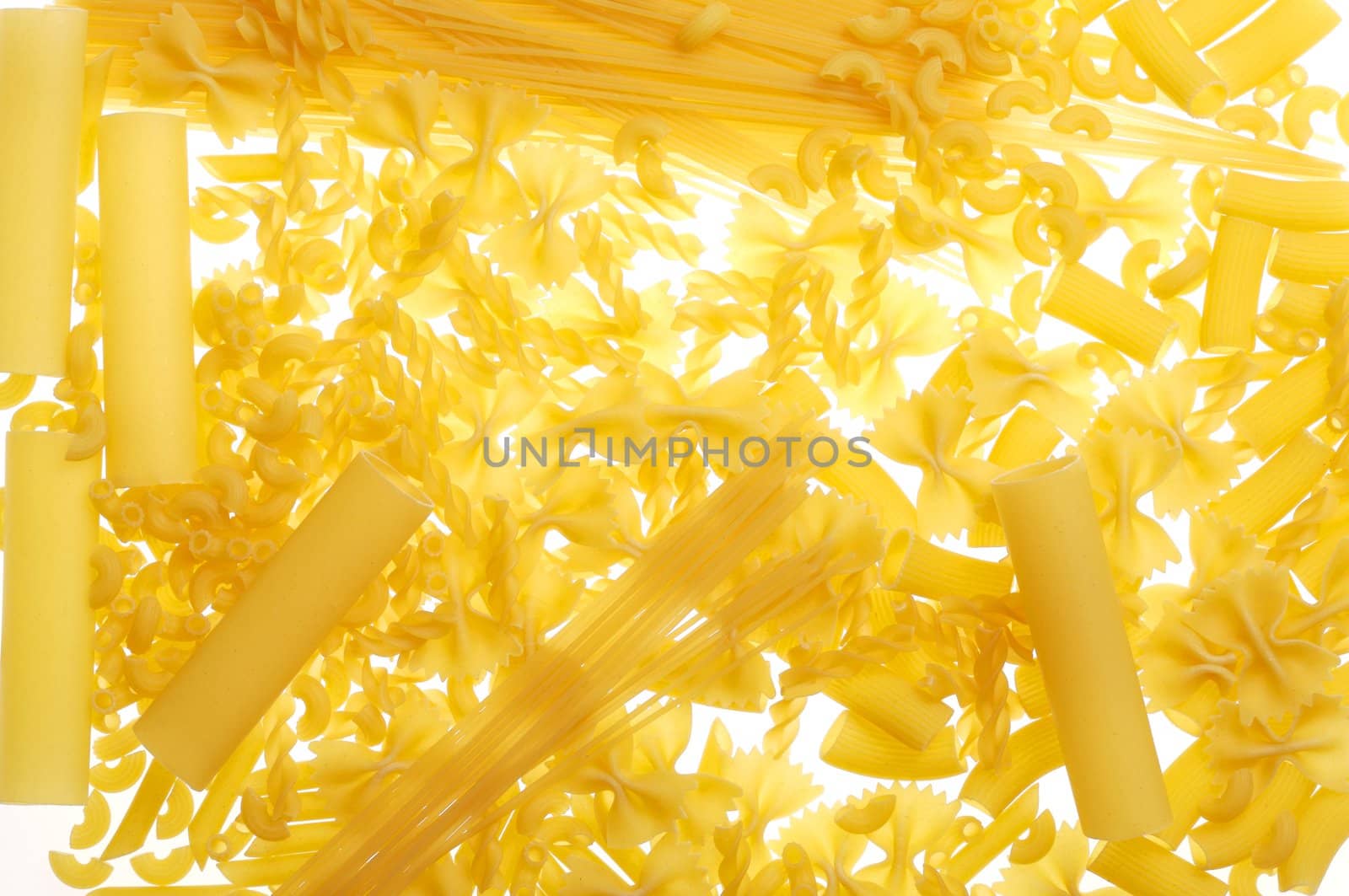 different dry pasta on white background
