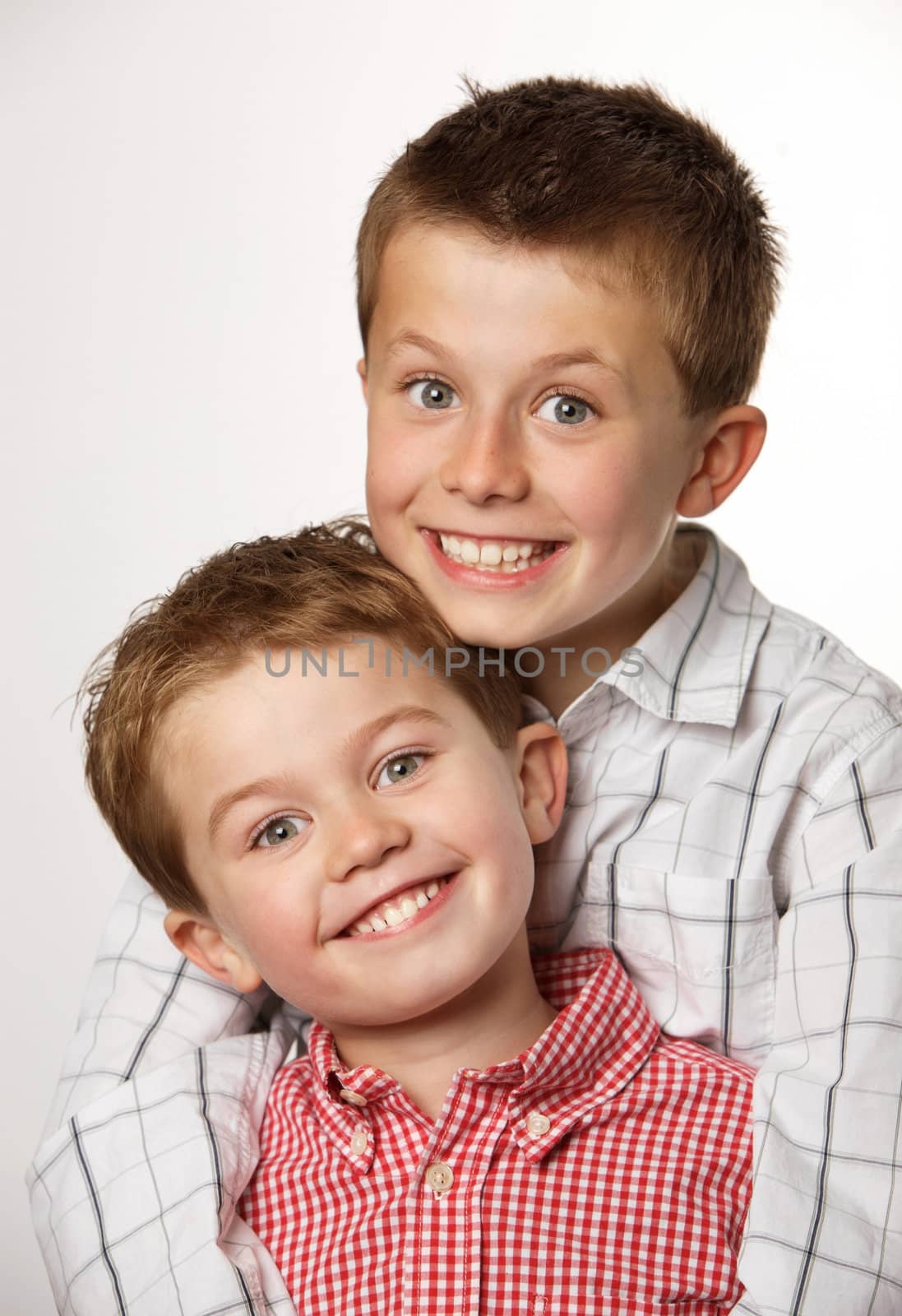 	
two cute young boys smilling