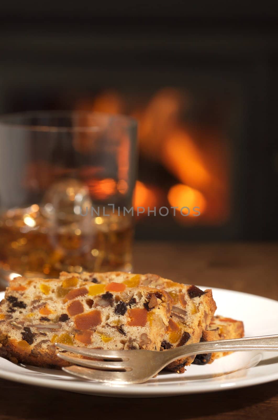 fruity cake with fireplace in the background