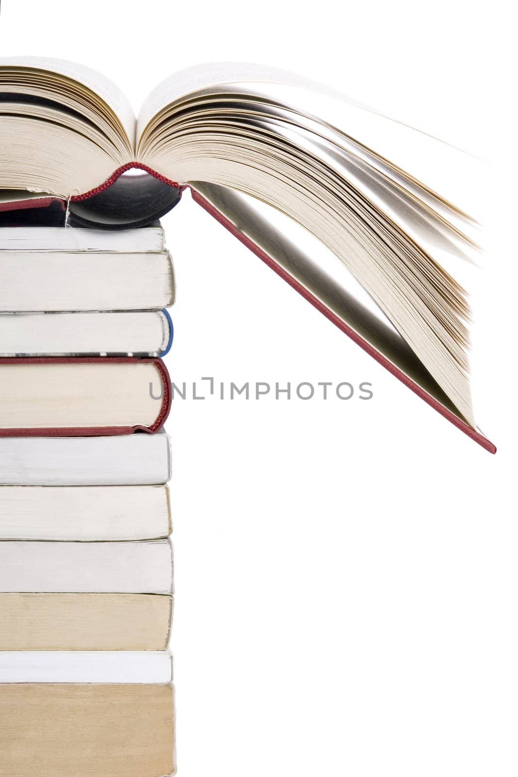 color tower books with open one arranged in stack