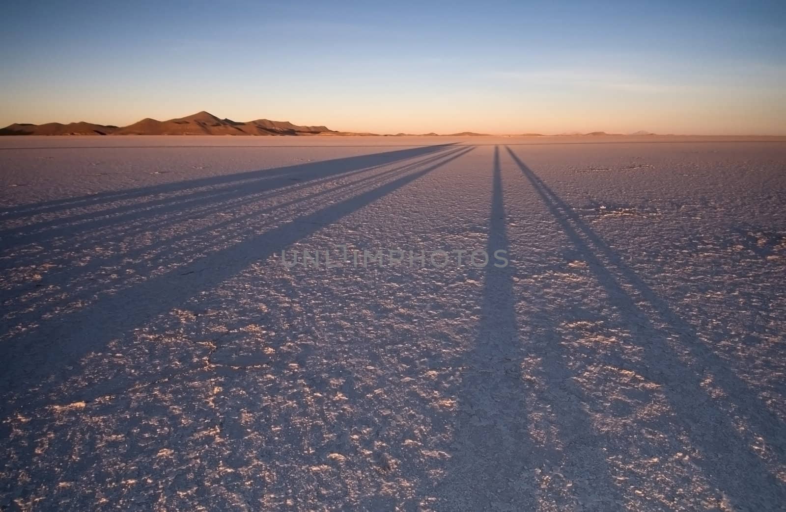 Sunrise casting magnificent shadows over the Bolivian Salt Flats.