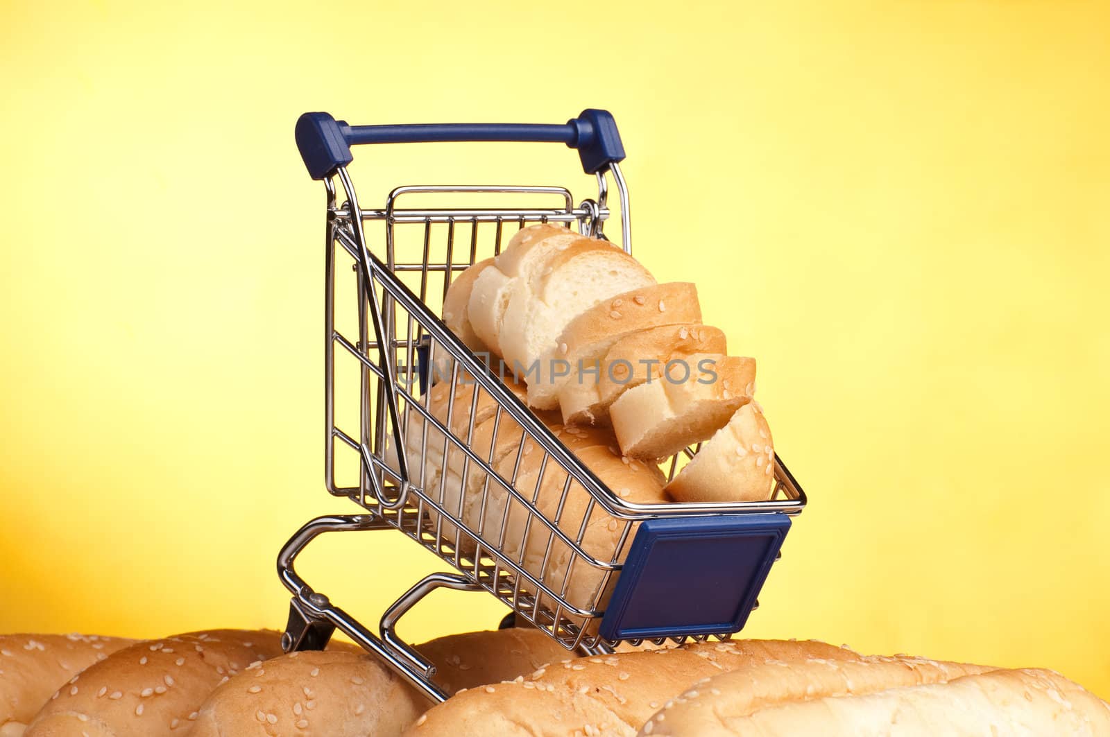 metal shopping trolley filled with bread by Erchog