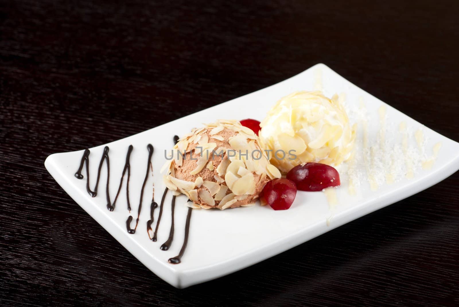 Dessert set of ice-cream with almond, chocolate and grapes