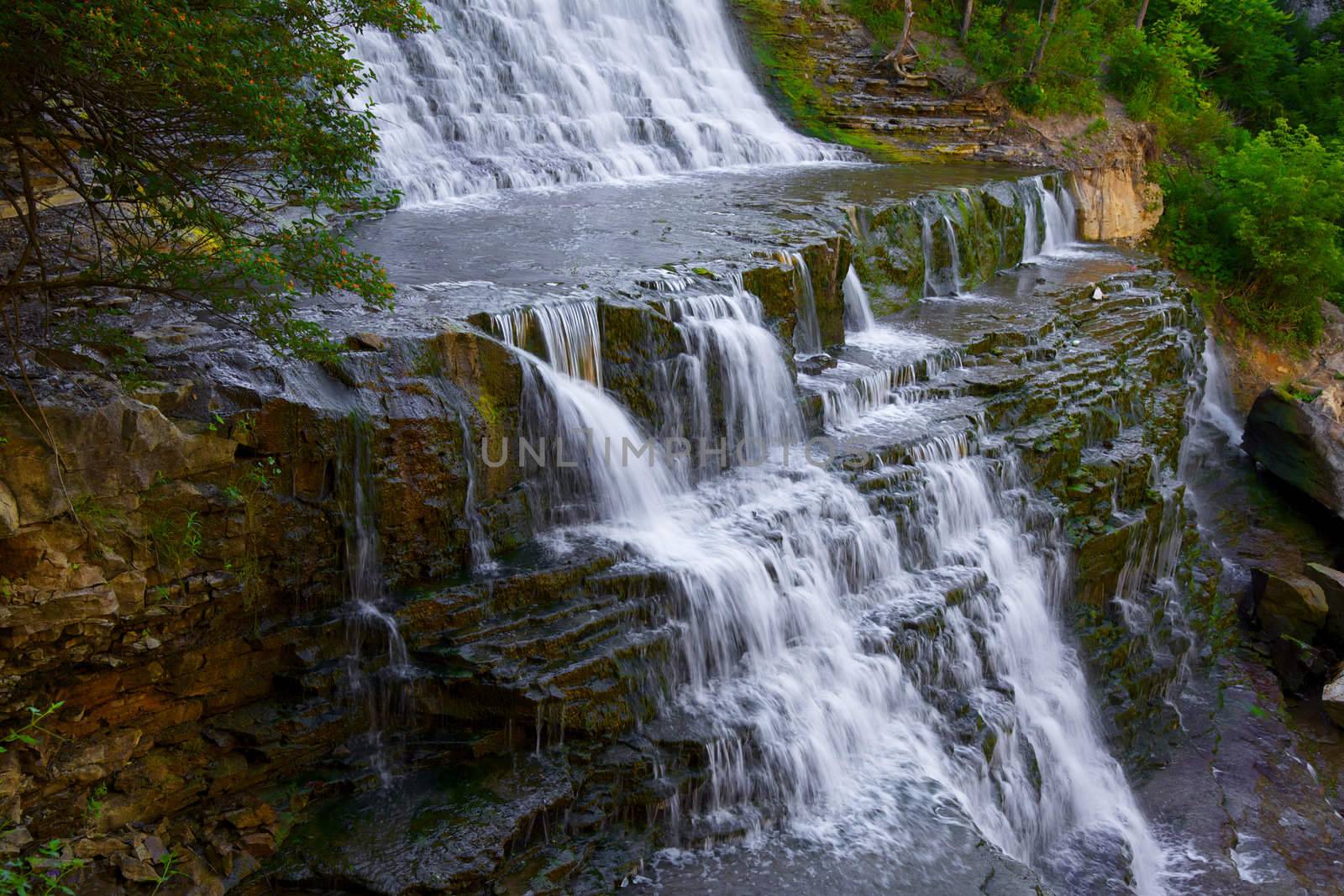 Inviting shelf at base of waterfall