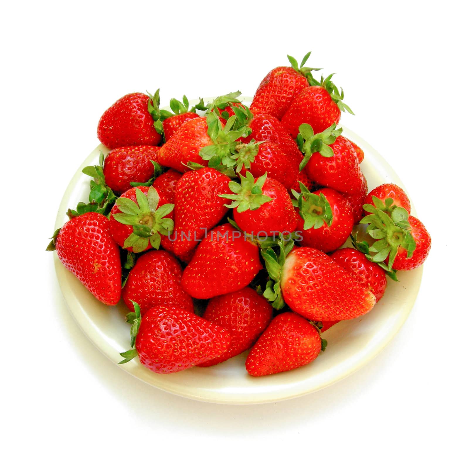 Detail of strawberries in a dish isolated over white