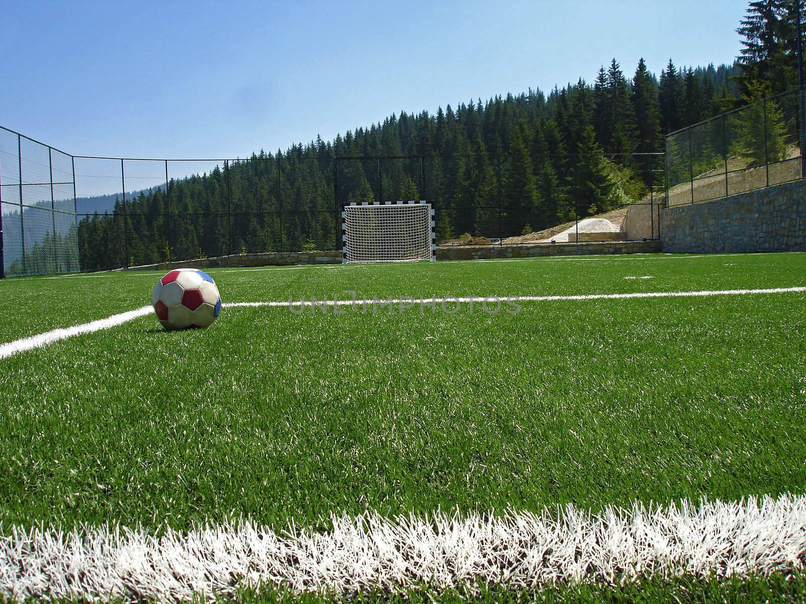 empty soccer field in the mountains                                 