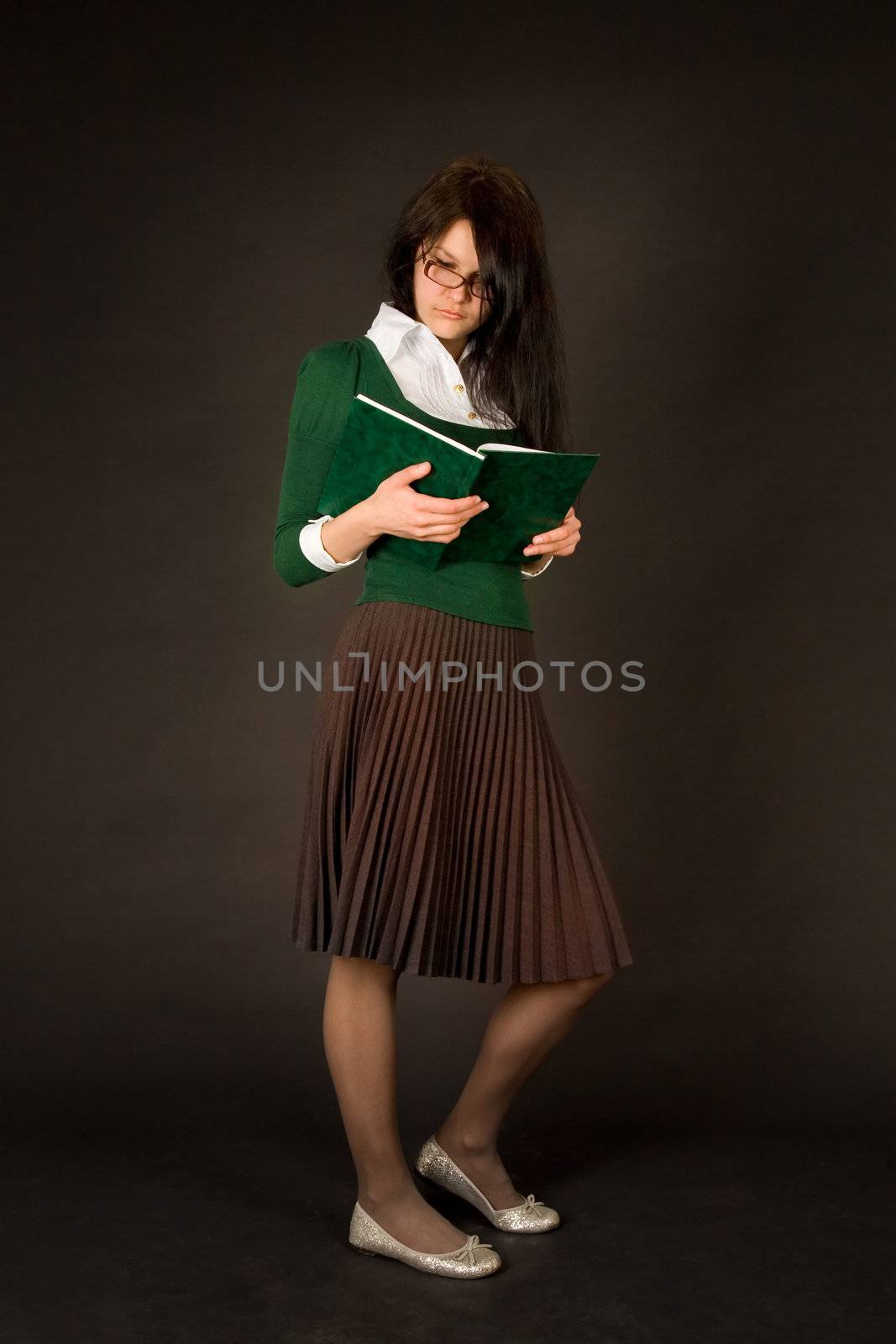 Businesswoman reading book isolated on black