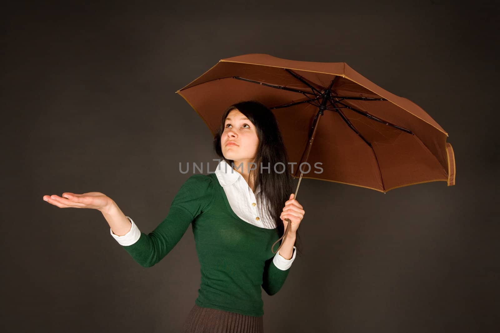 Girl with umbrella checking for rain  by Elisanth