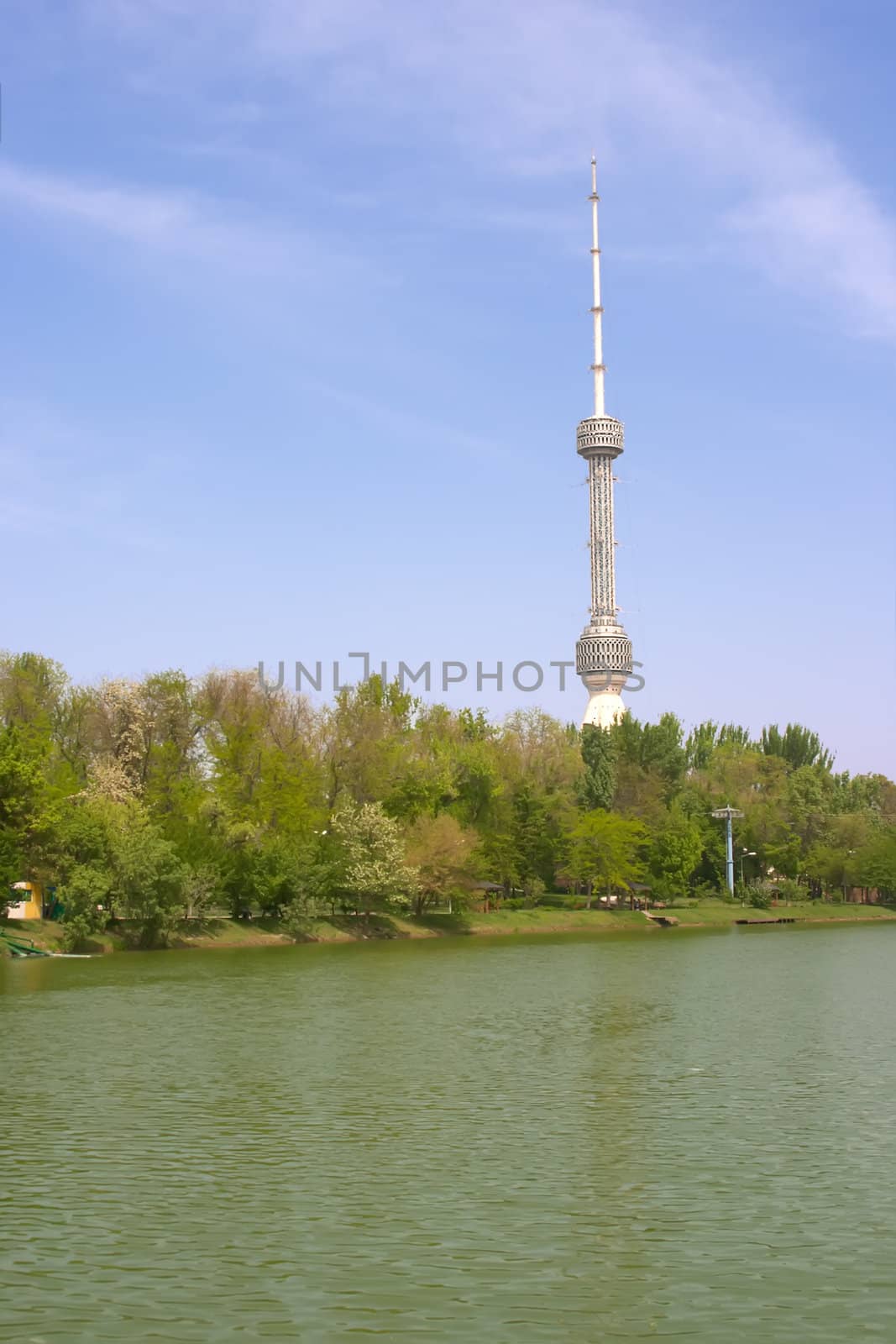 Large tv aerial in the sky with lake