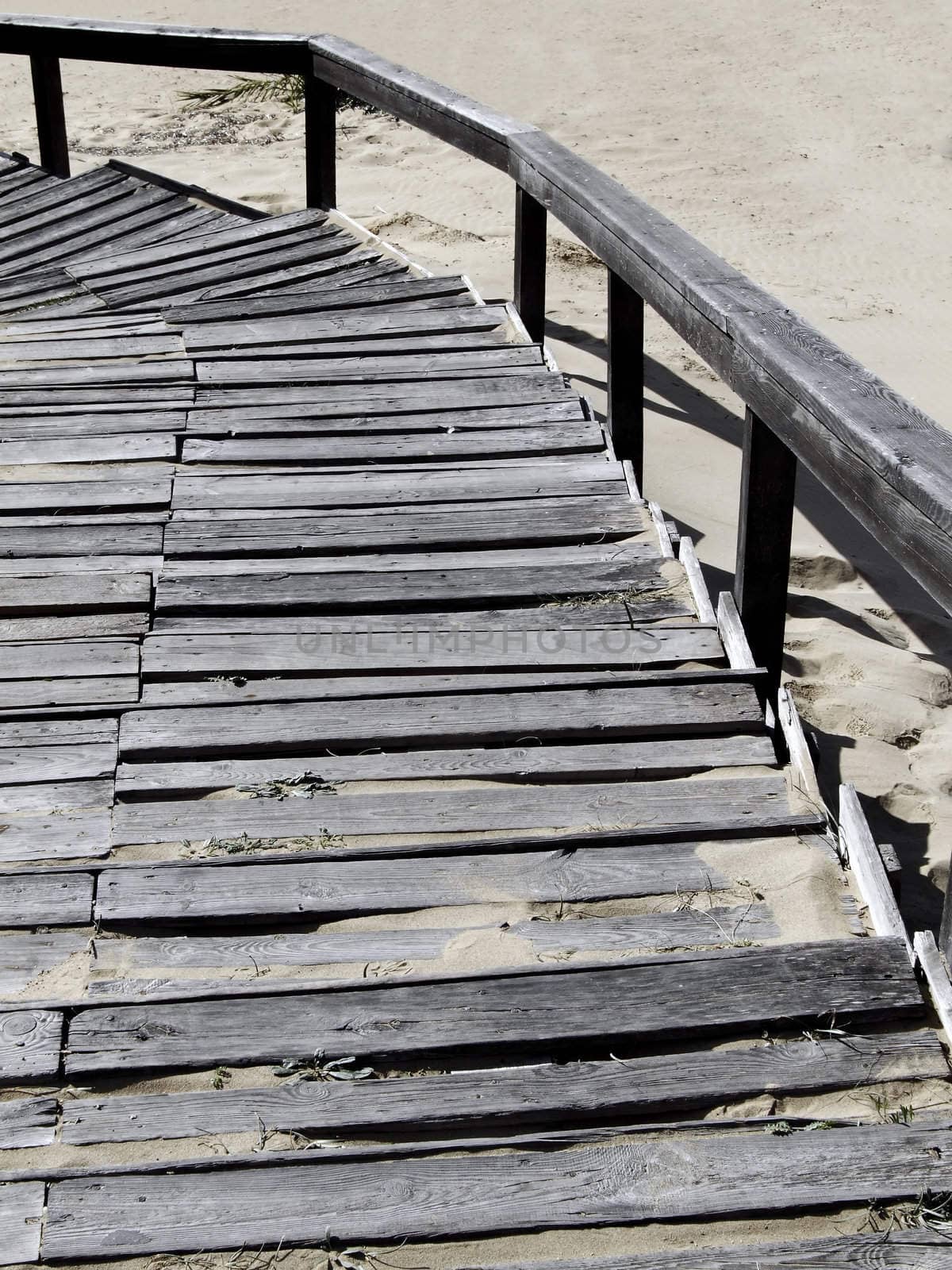 A wooden staircase leading down to beach