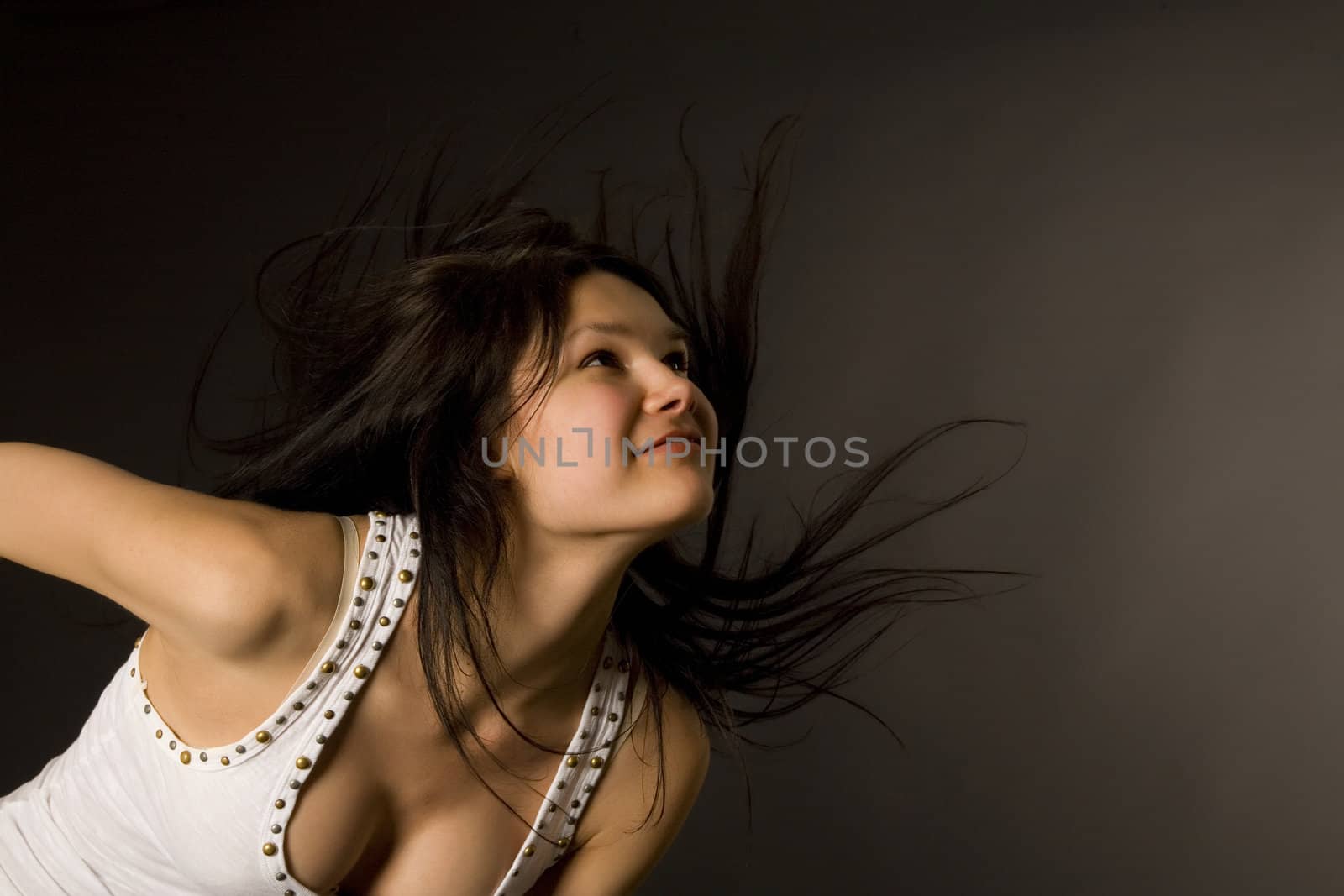 Attractive girl shaking her head isolated in studio