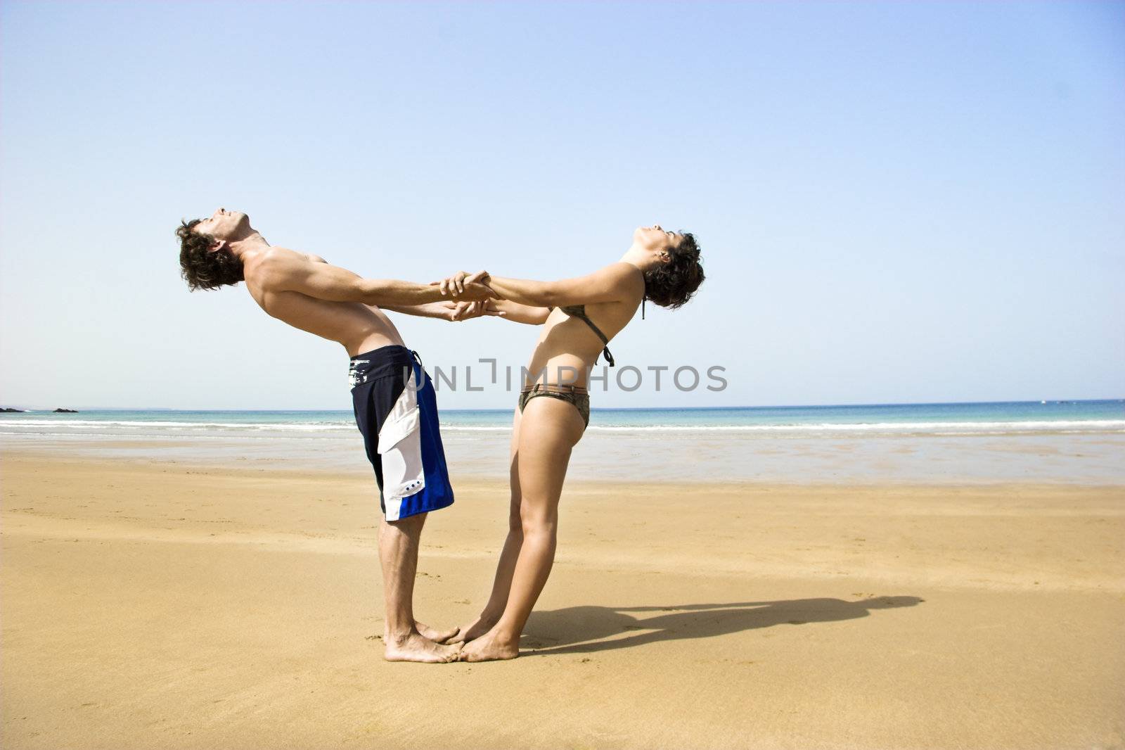 Young couple having fun on the beach