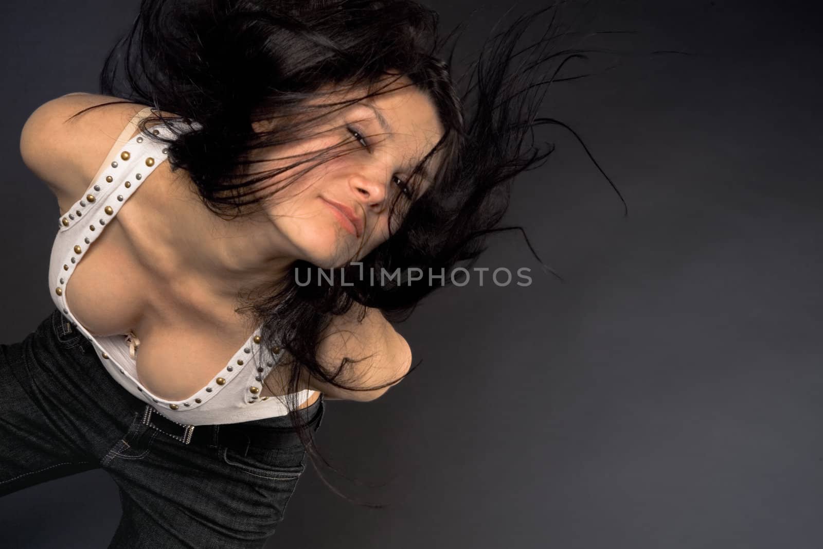 Fashion girl shaking her head isolated in studio