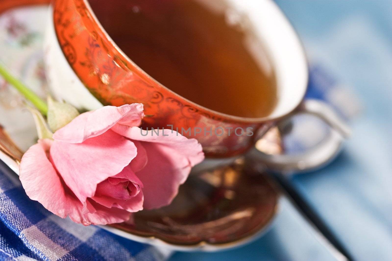 cup of tea with flower over azure