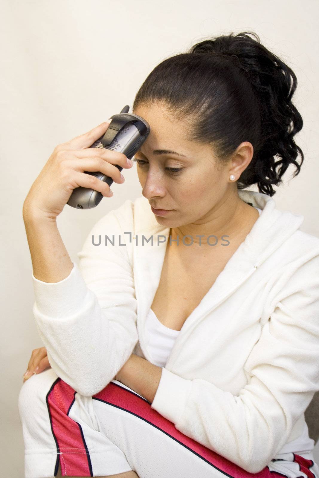 Woman with phone looking sad or depressed