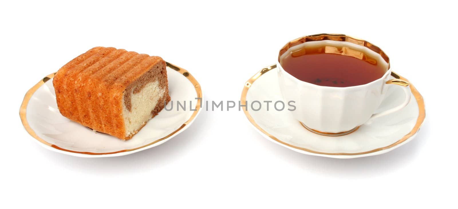 Sliced chocolate cake and cup of tea on a white background 