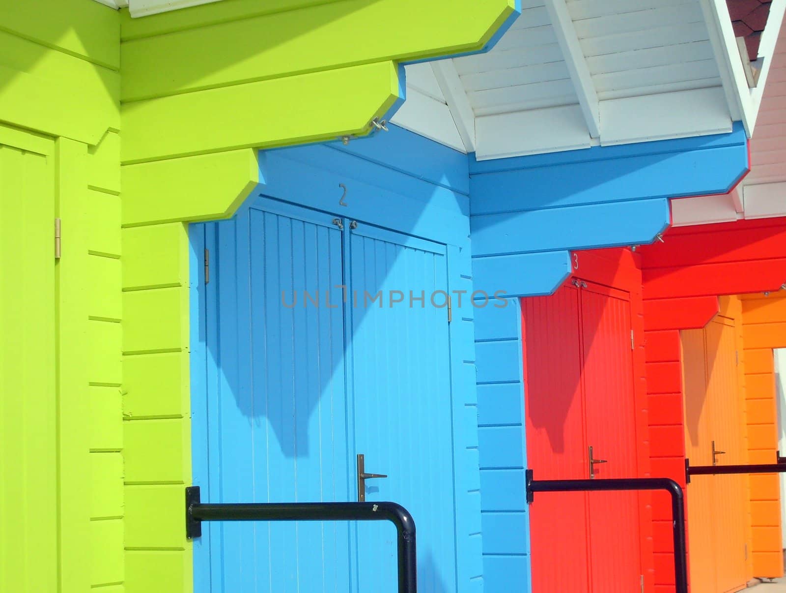 Colorful beach chalets by seaside, Scarborough North Bay, England, U.K.