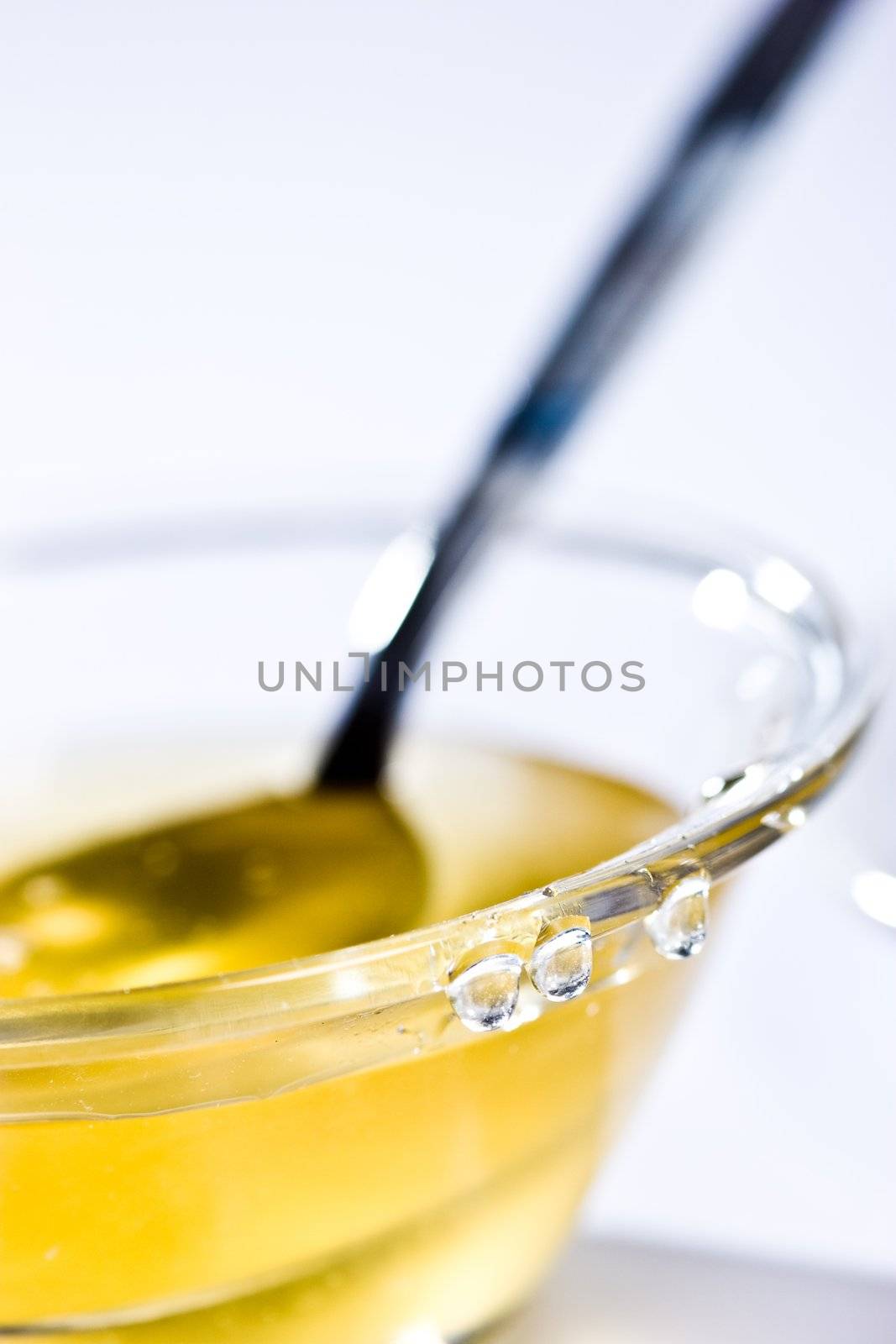 food series: glassy bowl with tasty honey and honey- drops