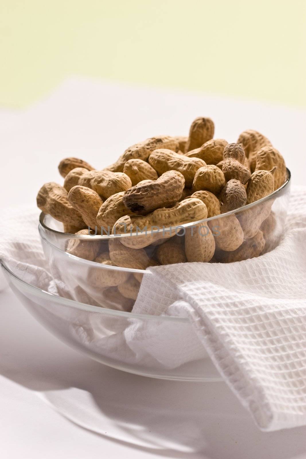 Foodstuff theme: peanut on the glassy bowl