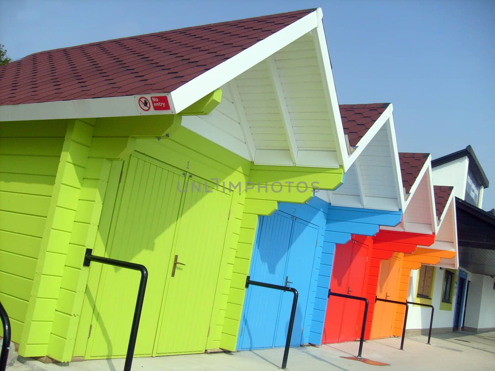 Colorful beach chalets by seaside, Scarborough North Bay, England, U.K.