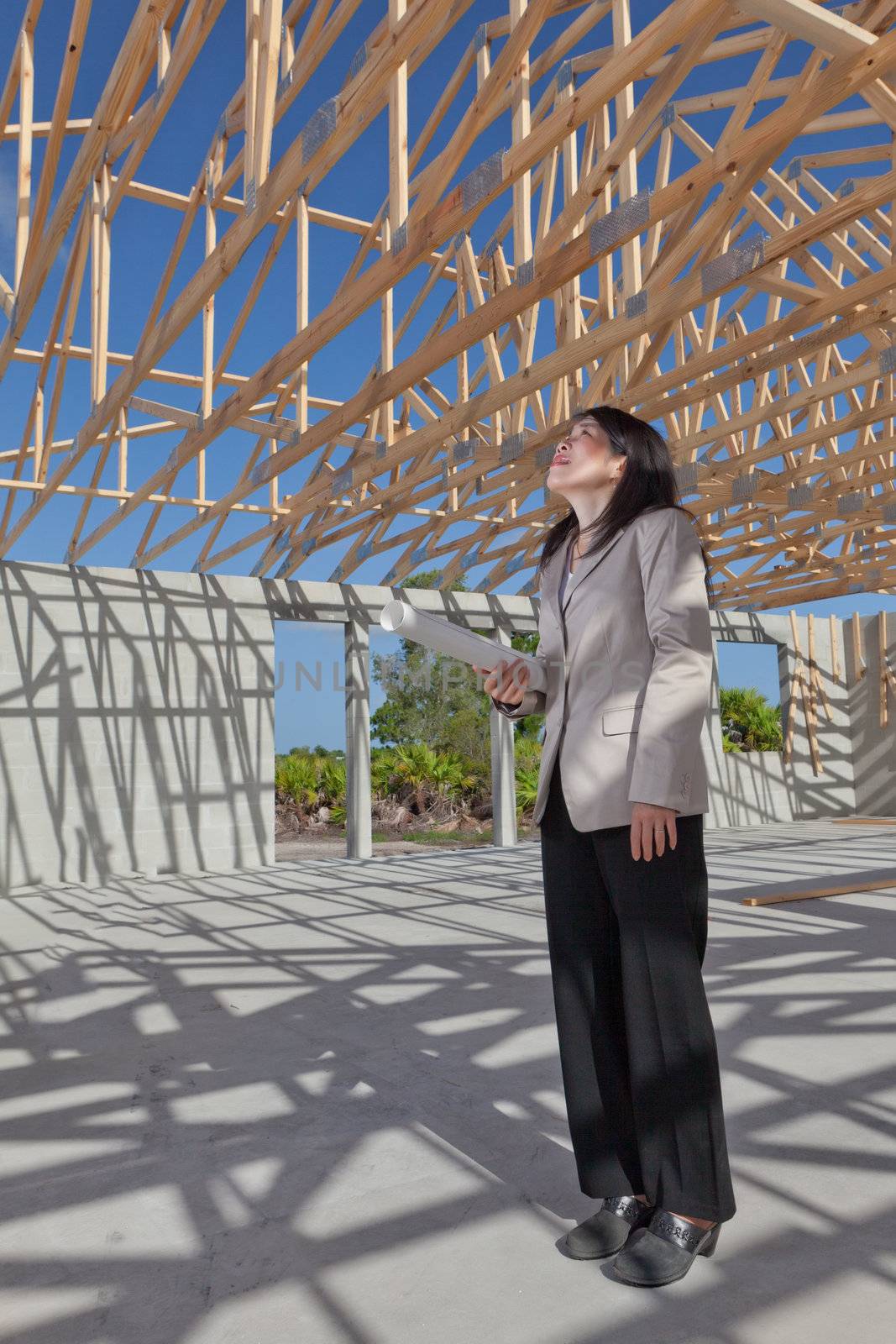 Asian woman contractor with a set clipboard  by Orchidflower