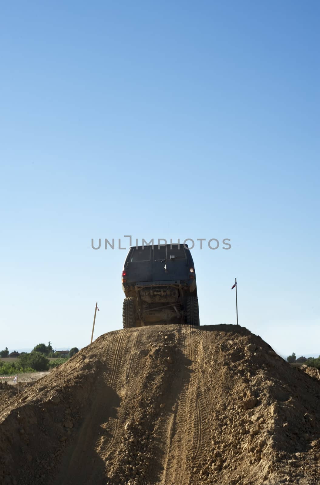 Jeep coming out of a muddy hole during a demonstration