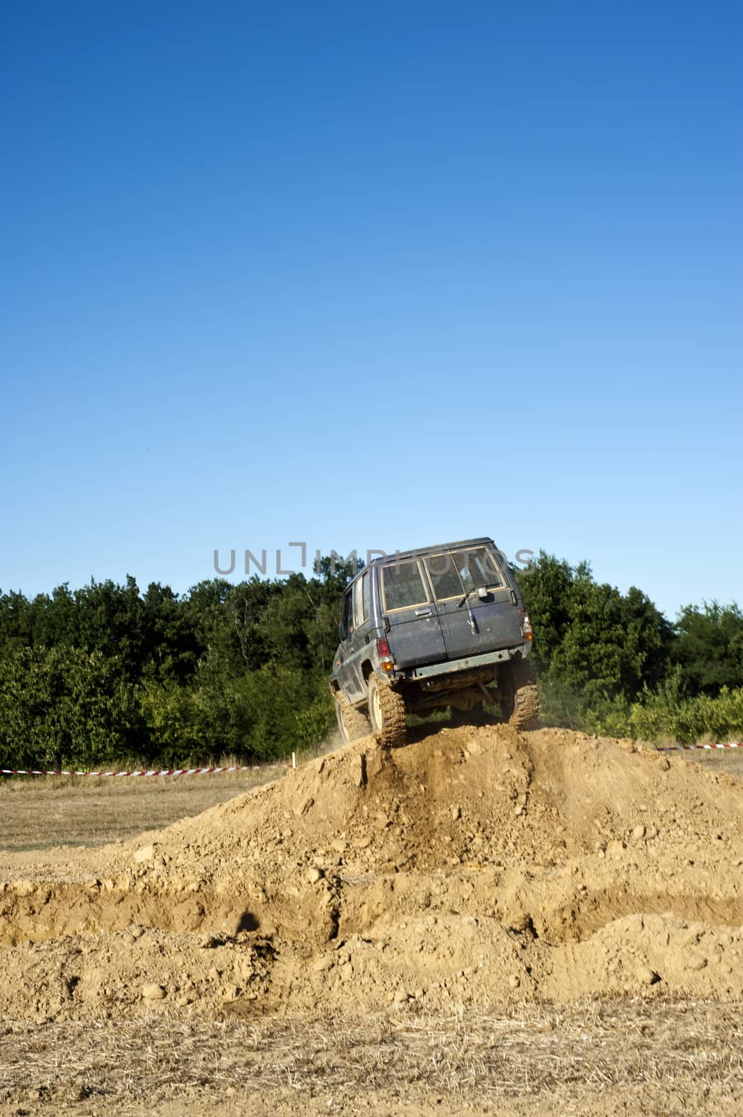 Jeep coming out of a muddy hole during a demonstration