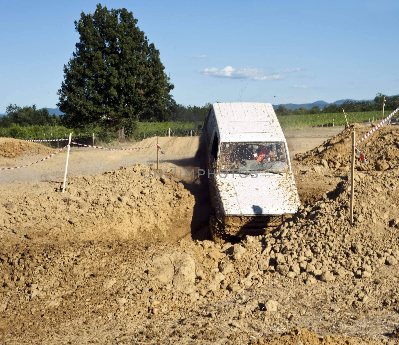 Jeep coming out of a muddy hole during a demonstration