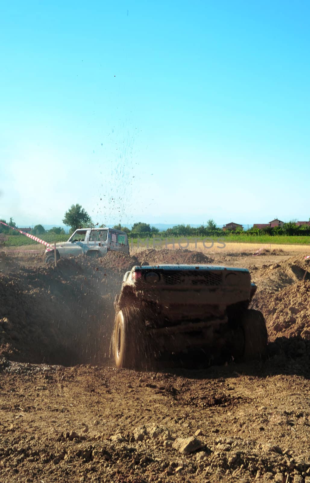 Jeep coming out of a muddy hole during a demonstration