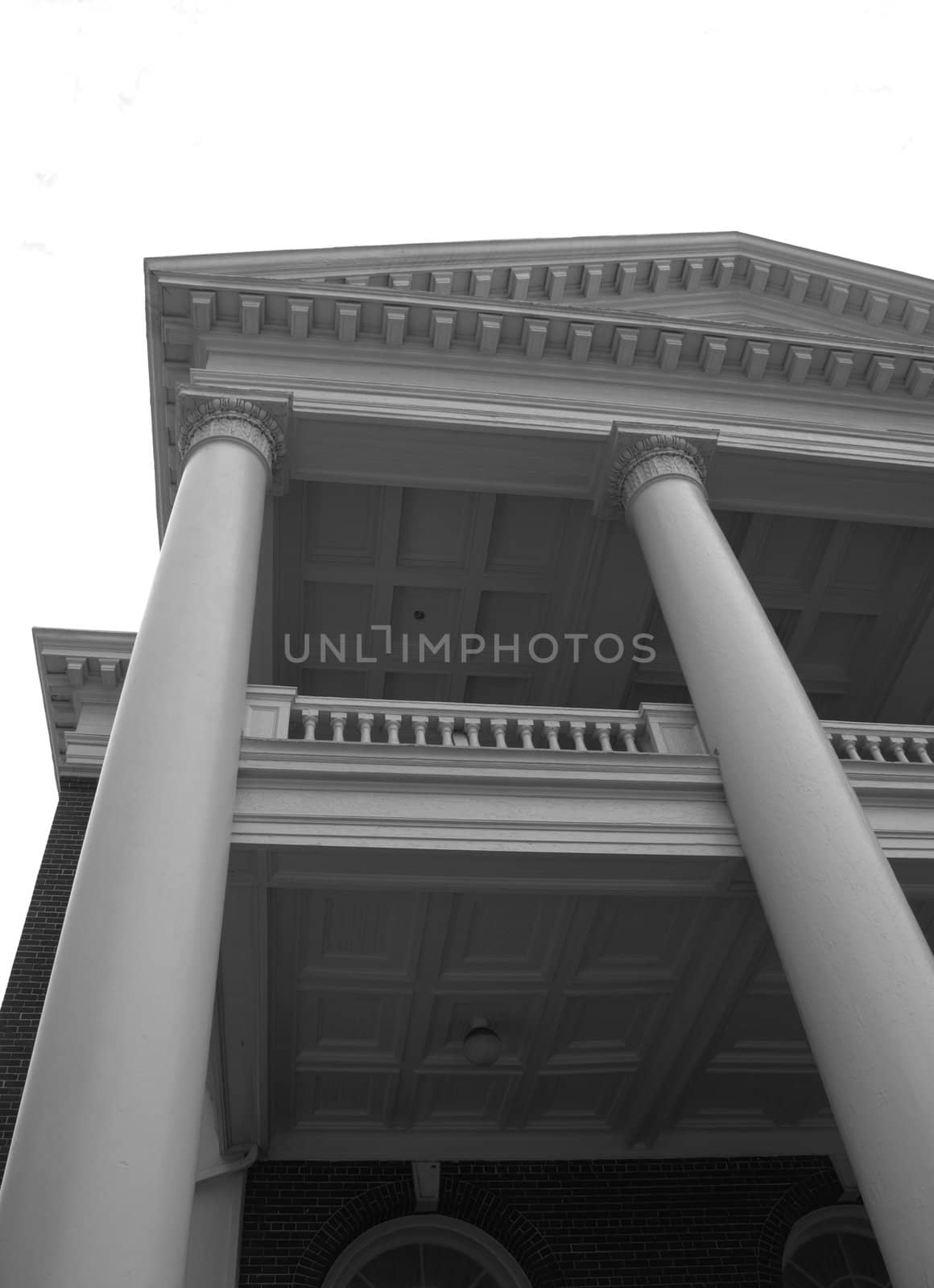 An old building in the south with tall columns shown in black and white.