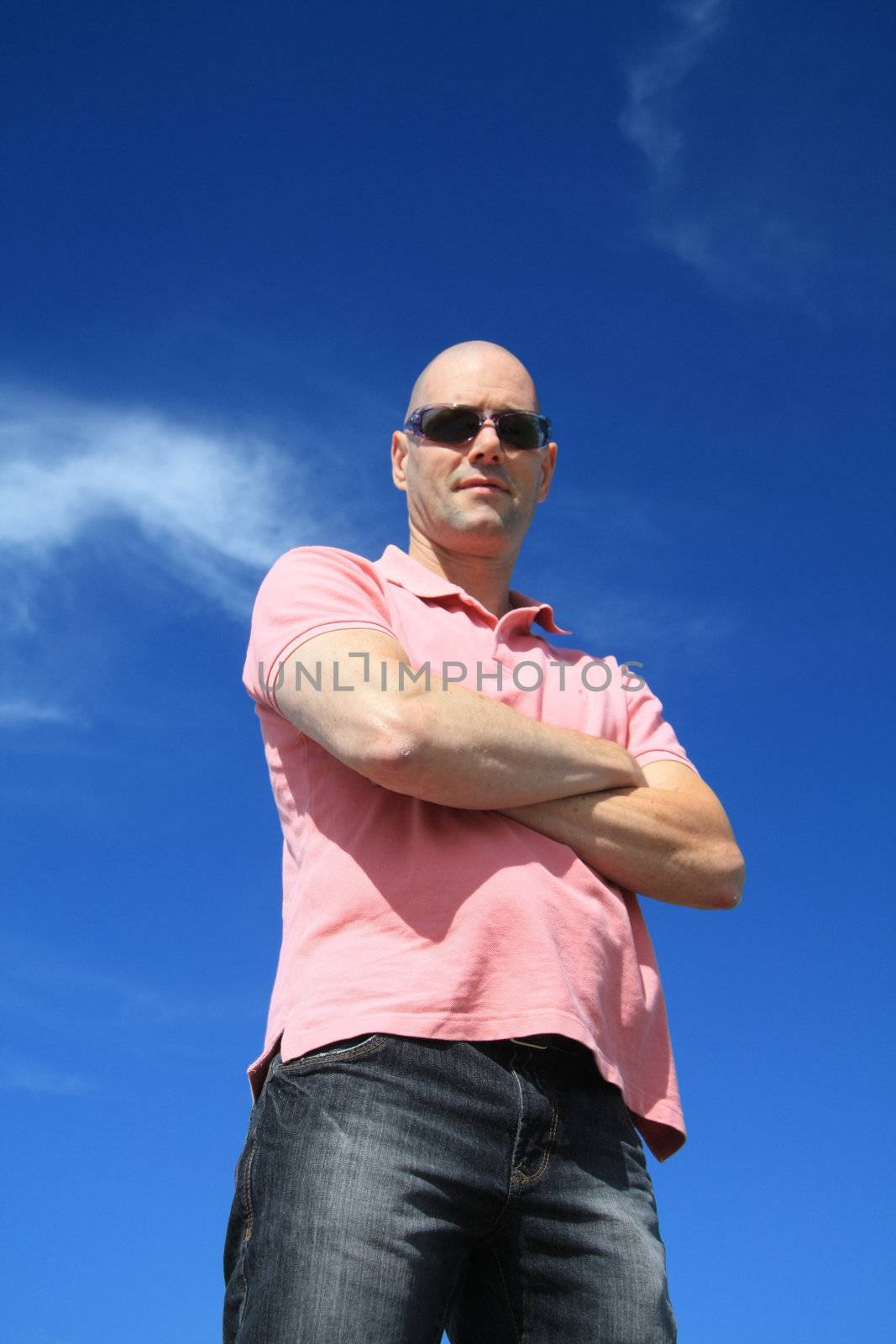 A bold caucasian man wearing sunglasses