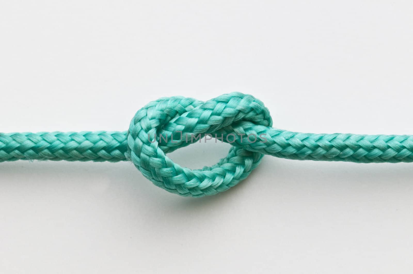 A simple knot on a green rope