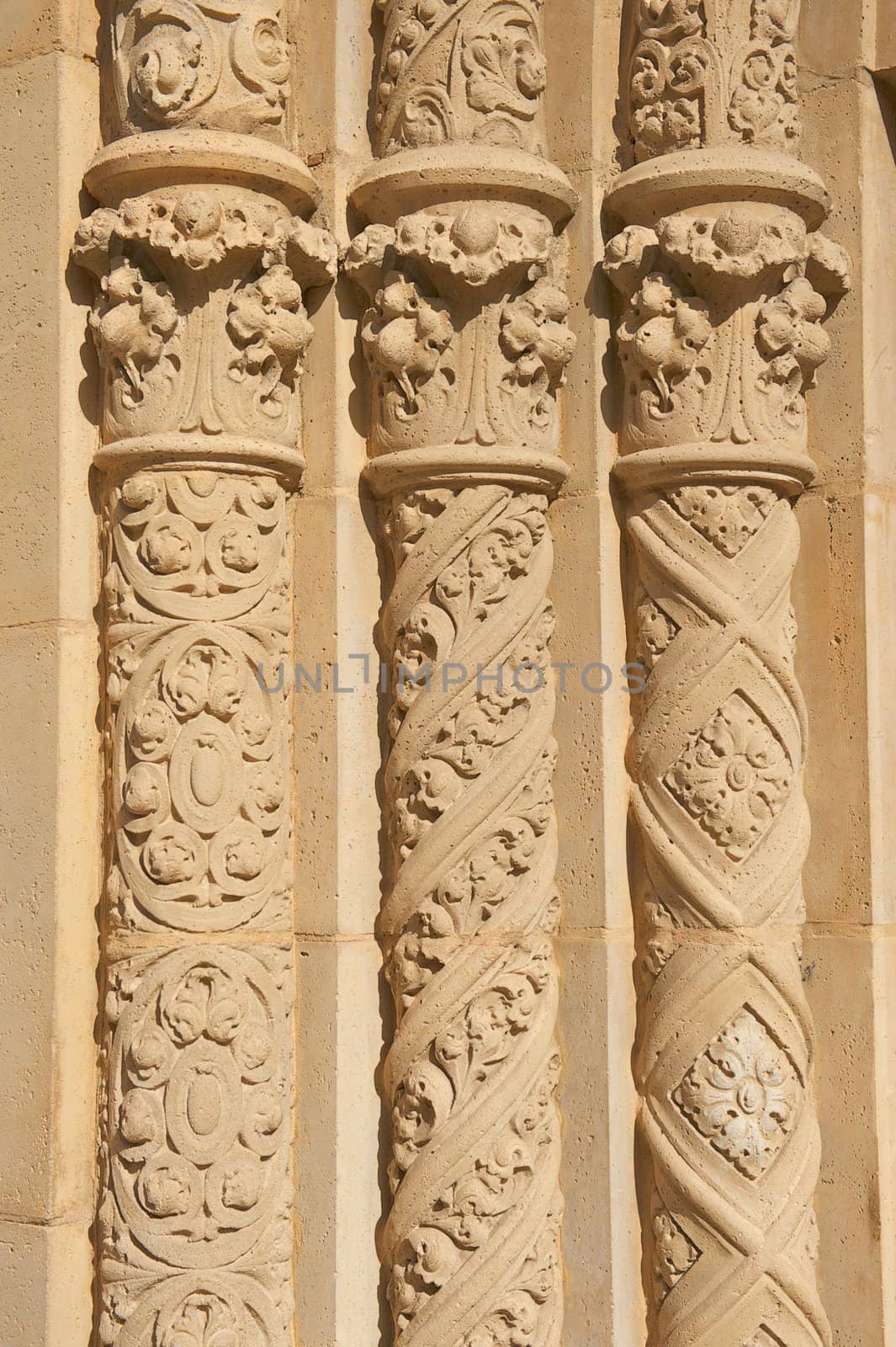 Three Ornate Circular Pillars Made of Stucco by pixelsnap