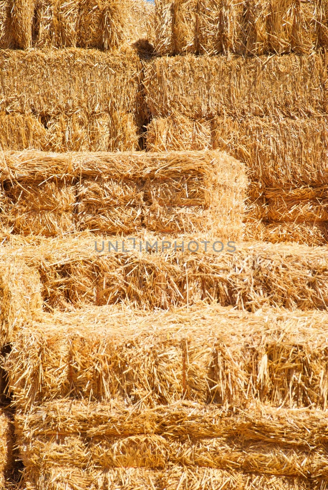 Vertical Stack of Hay Bailes by pixelsnap