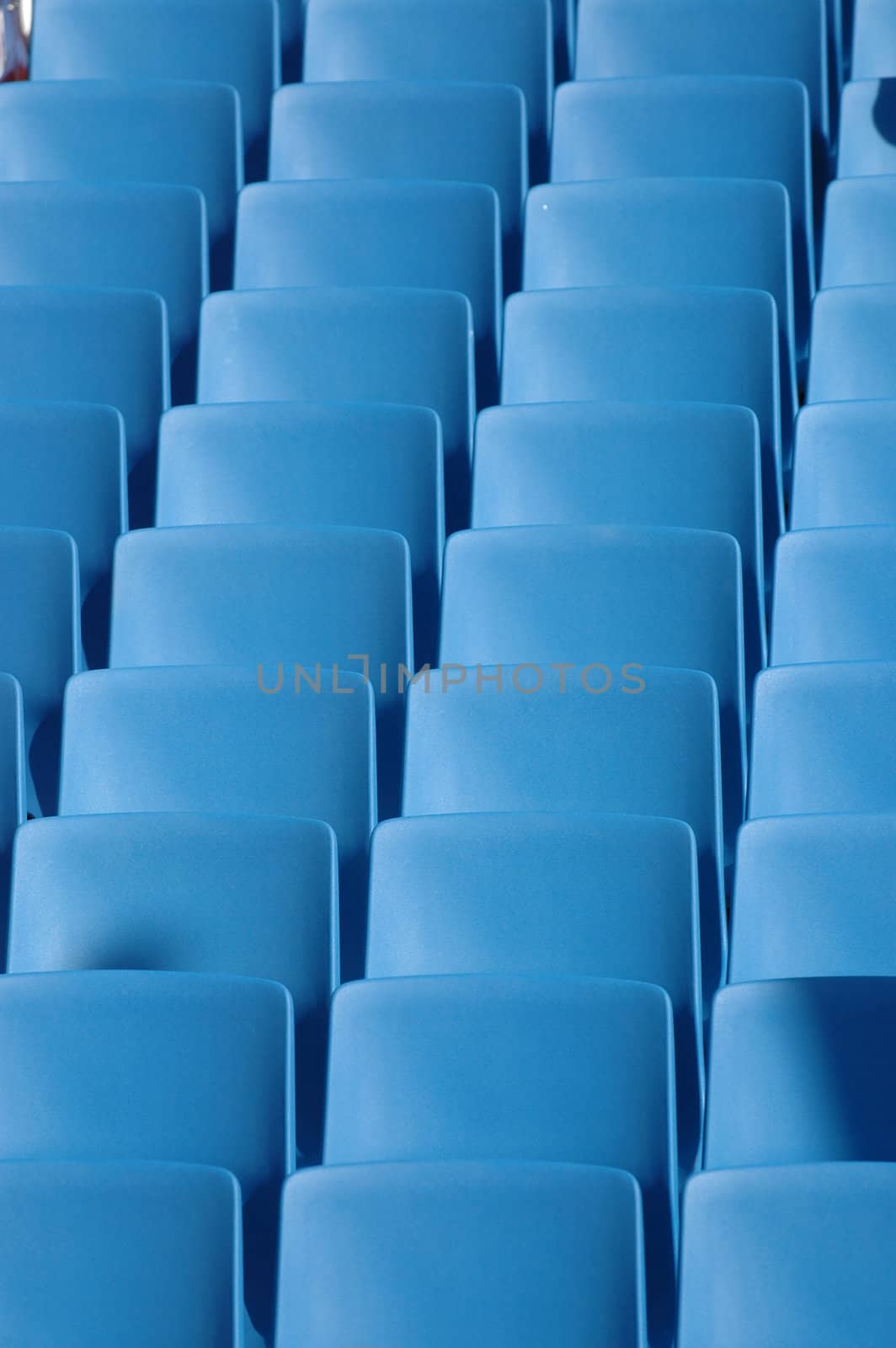 Long rows of blue chairs.