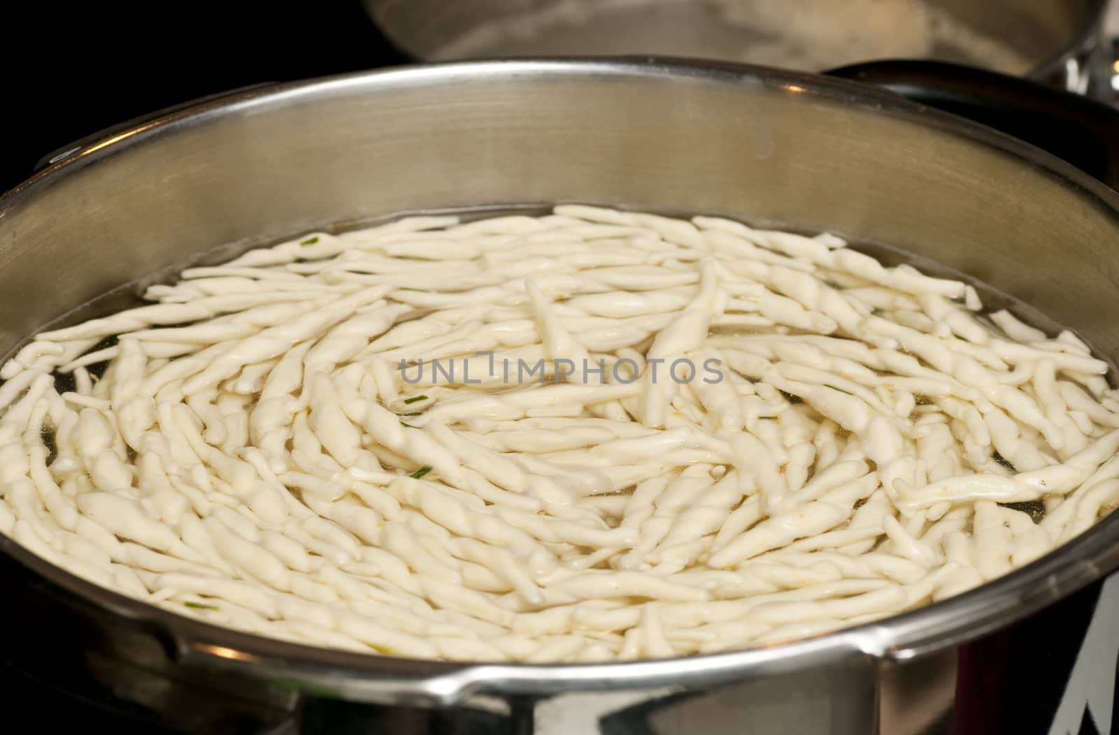 cooking traditional italian pasta in a large pot