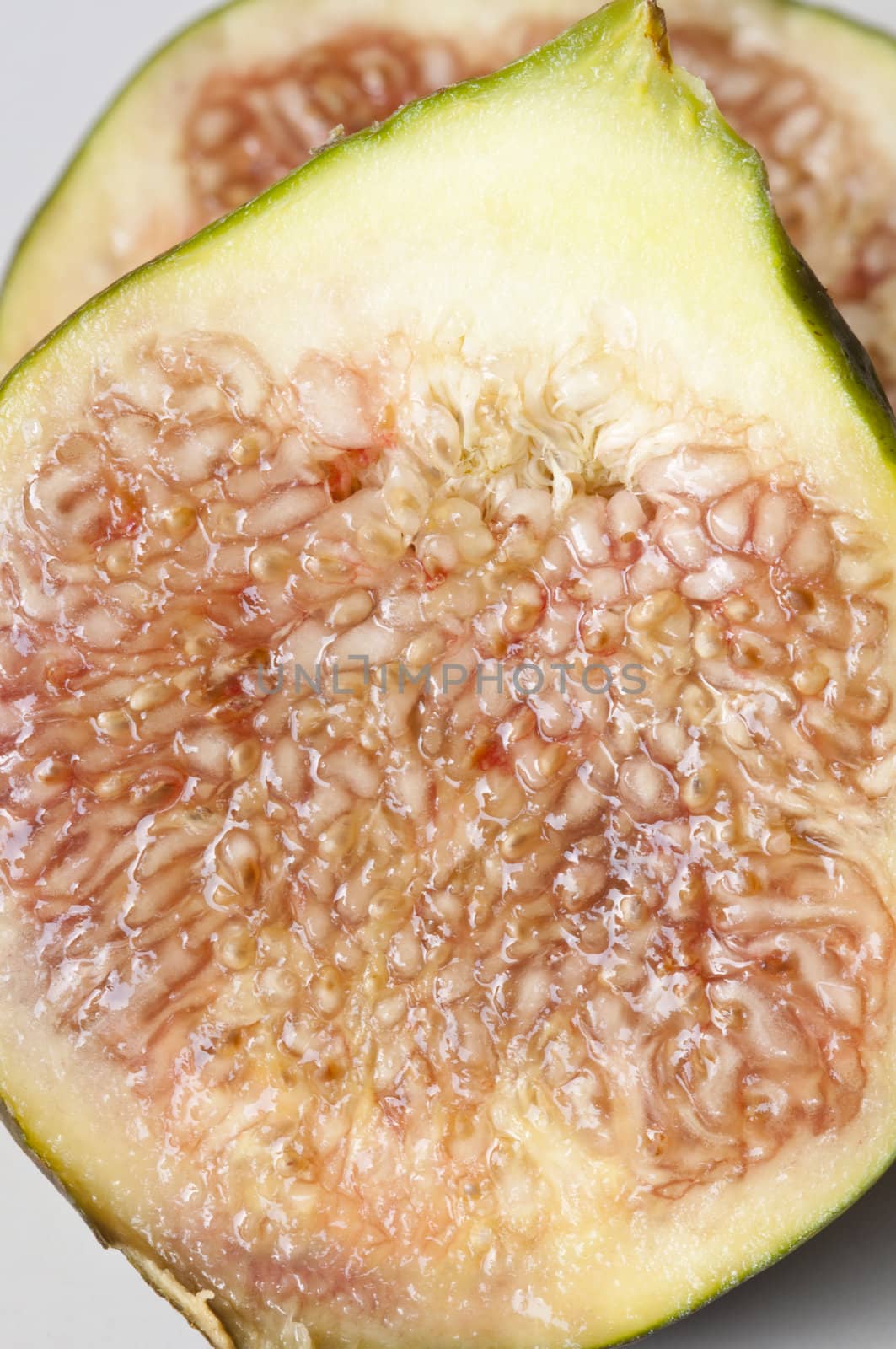 Isolated fresh sliced figs in white background