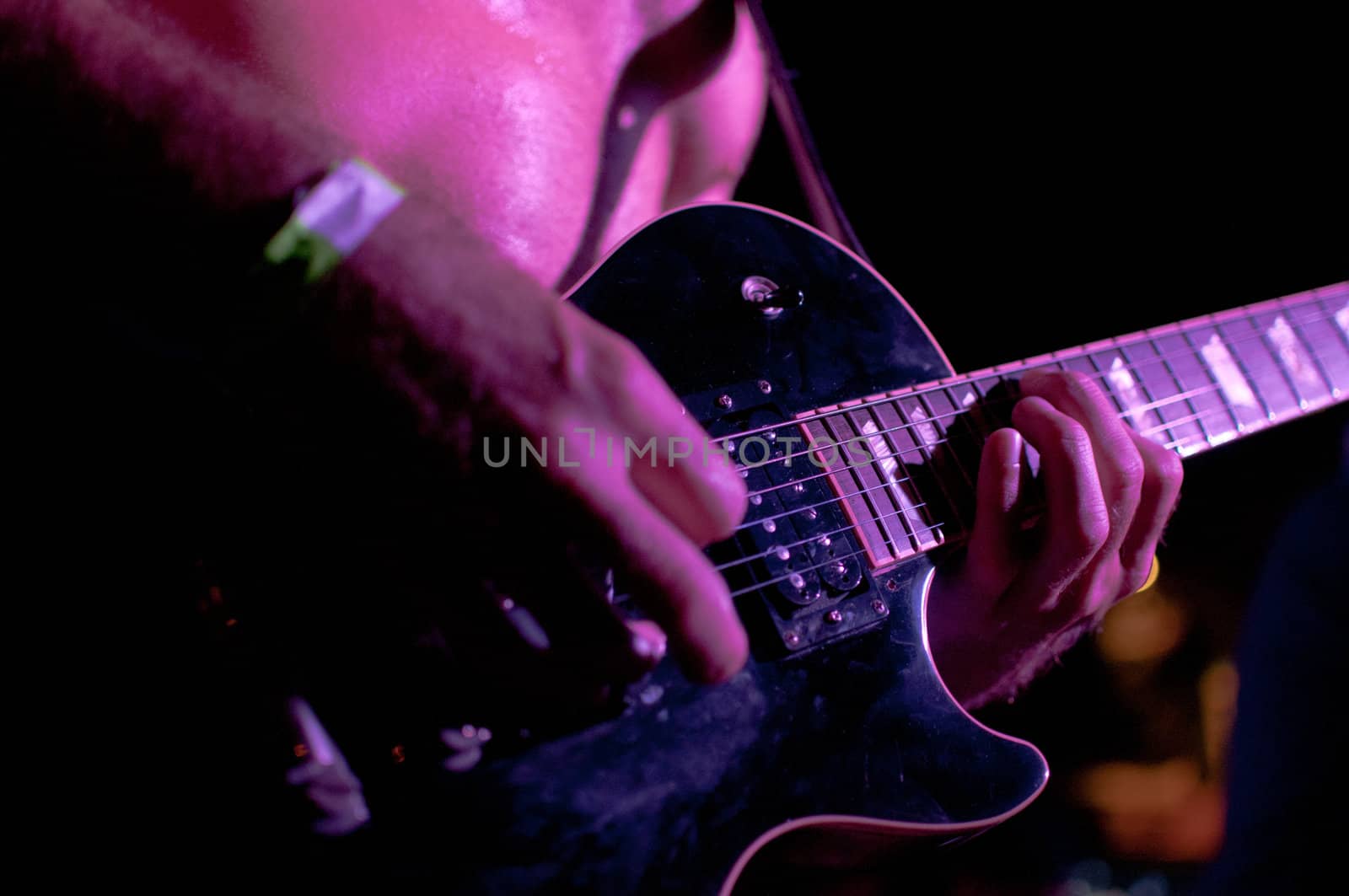 Guitarist playing during a concert