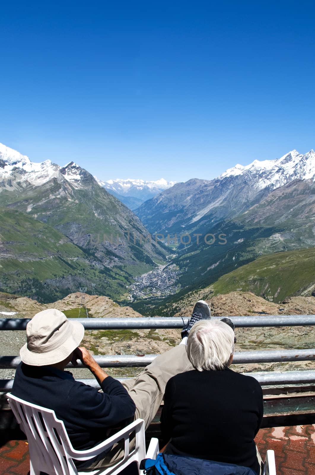 An elderly couple enjoying the view overlooking Zermatt, Switzerland, Picture taken 2008-07-15