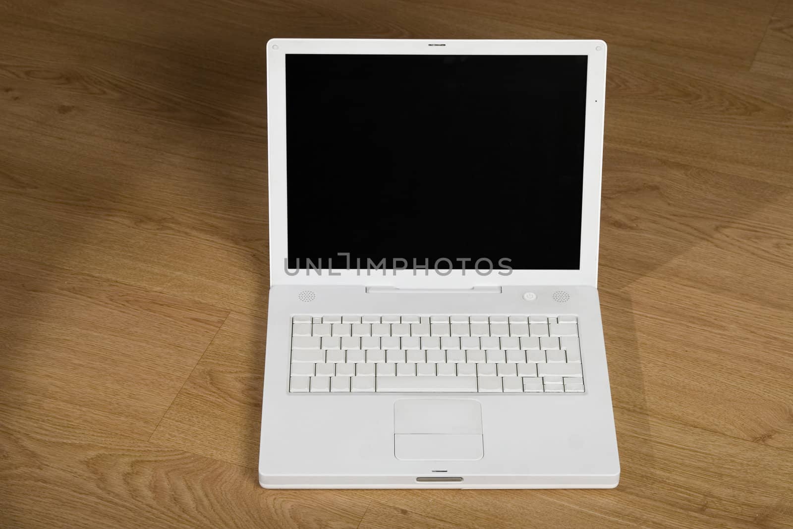 front view of white notebook on wooden background
