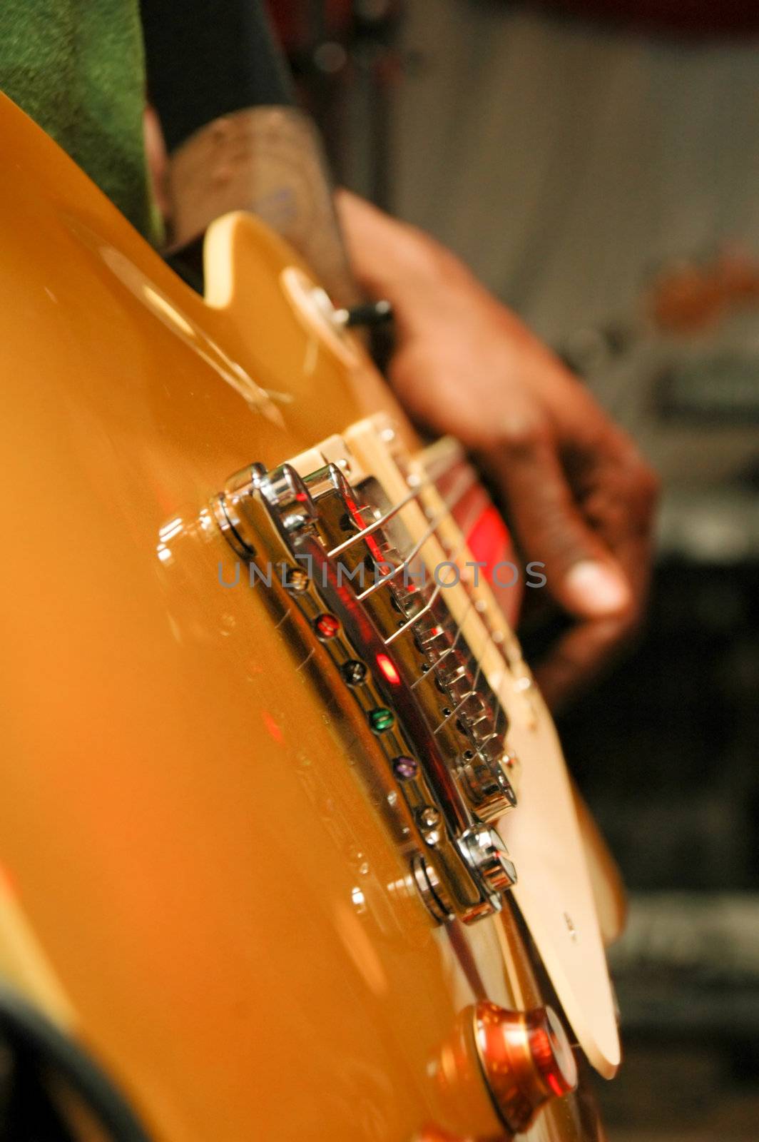 Closeup of guitar strings. Taken at a concert.