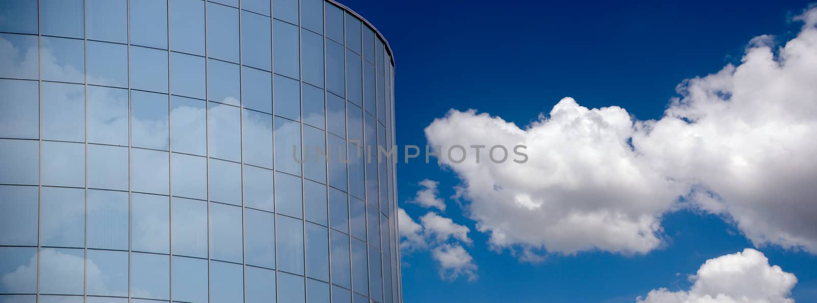 Corporate building and clouds.