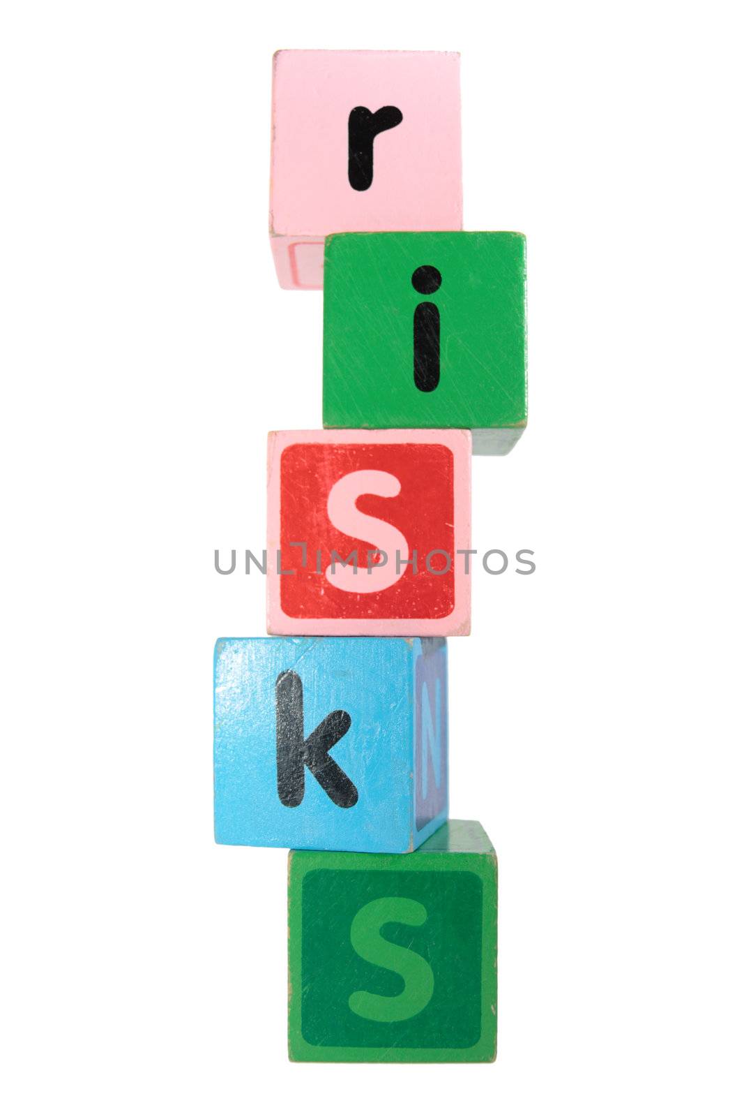 assorted childrens toy letter building blocks against a white background that spell risks