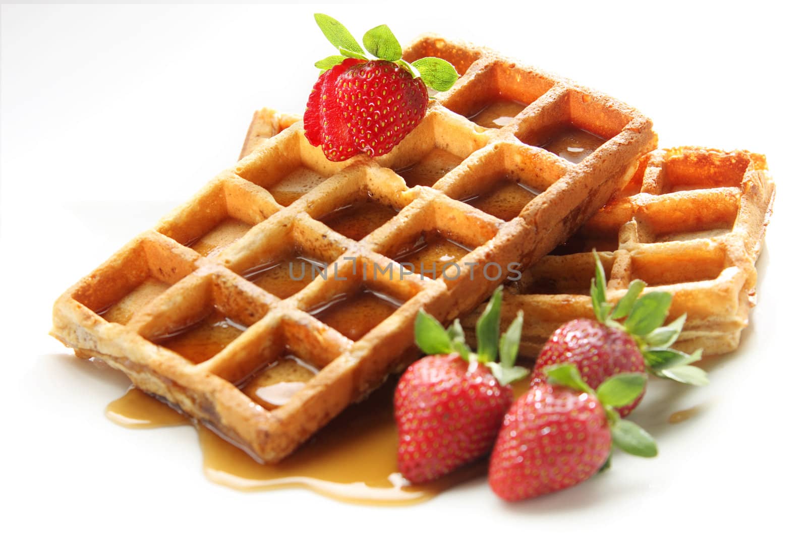 waffle breakfast with strawberry and honey maple syrup