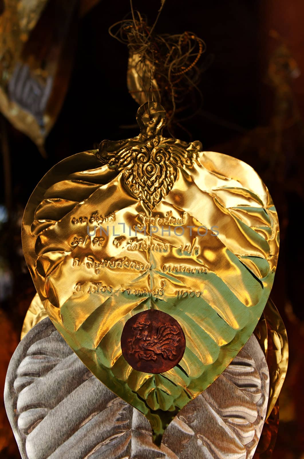  Golden Leaf with inscription in a temple in Thaialand