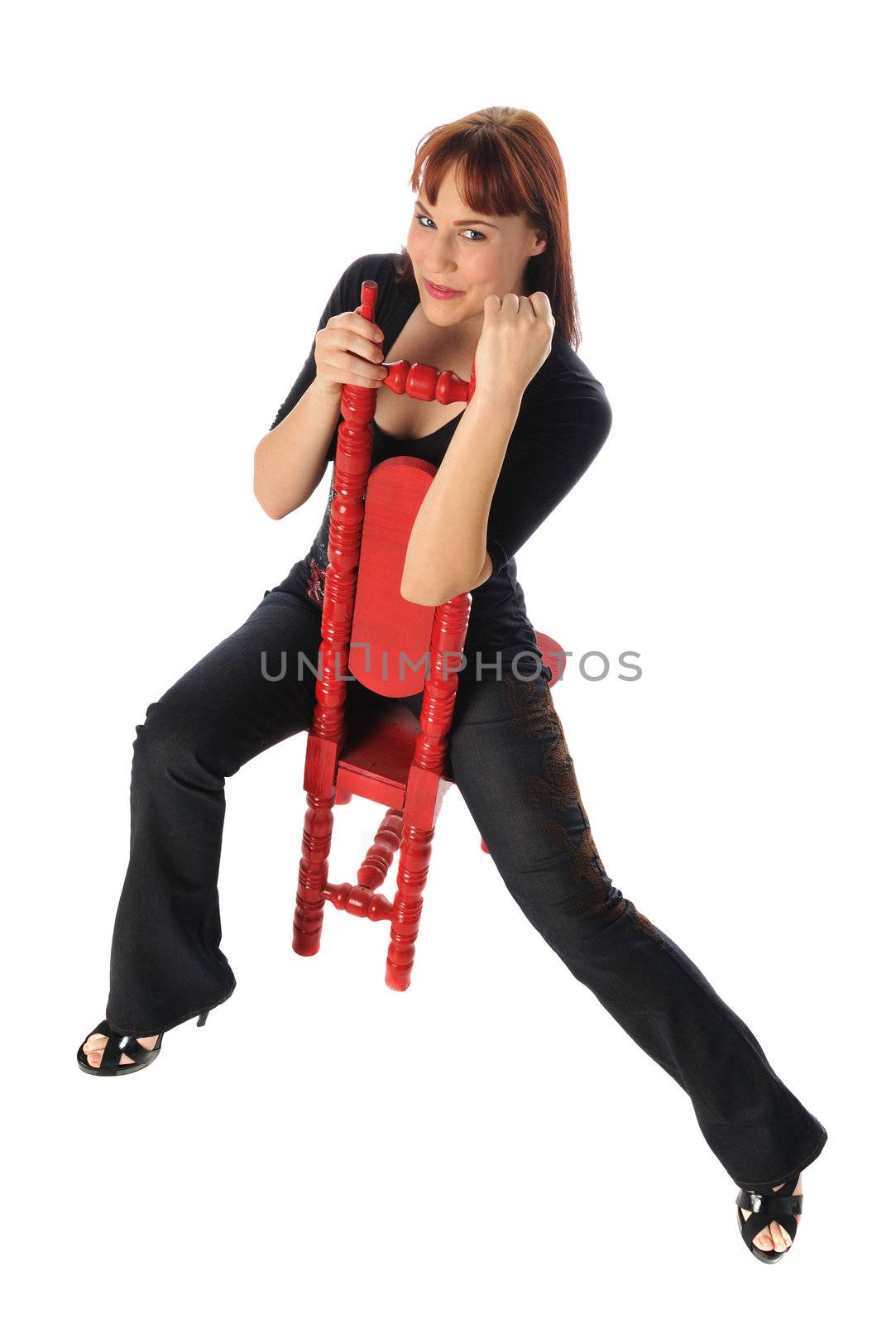 Attractive young woman in a tall back chair on a white background