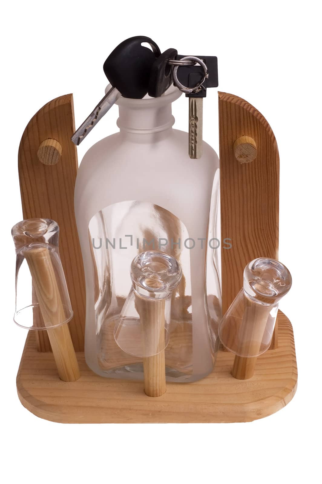 Bottle of alcohol with car keys to white background 