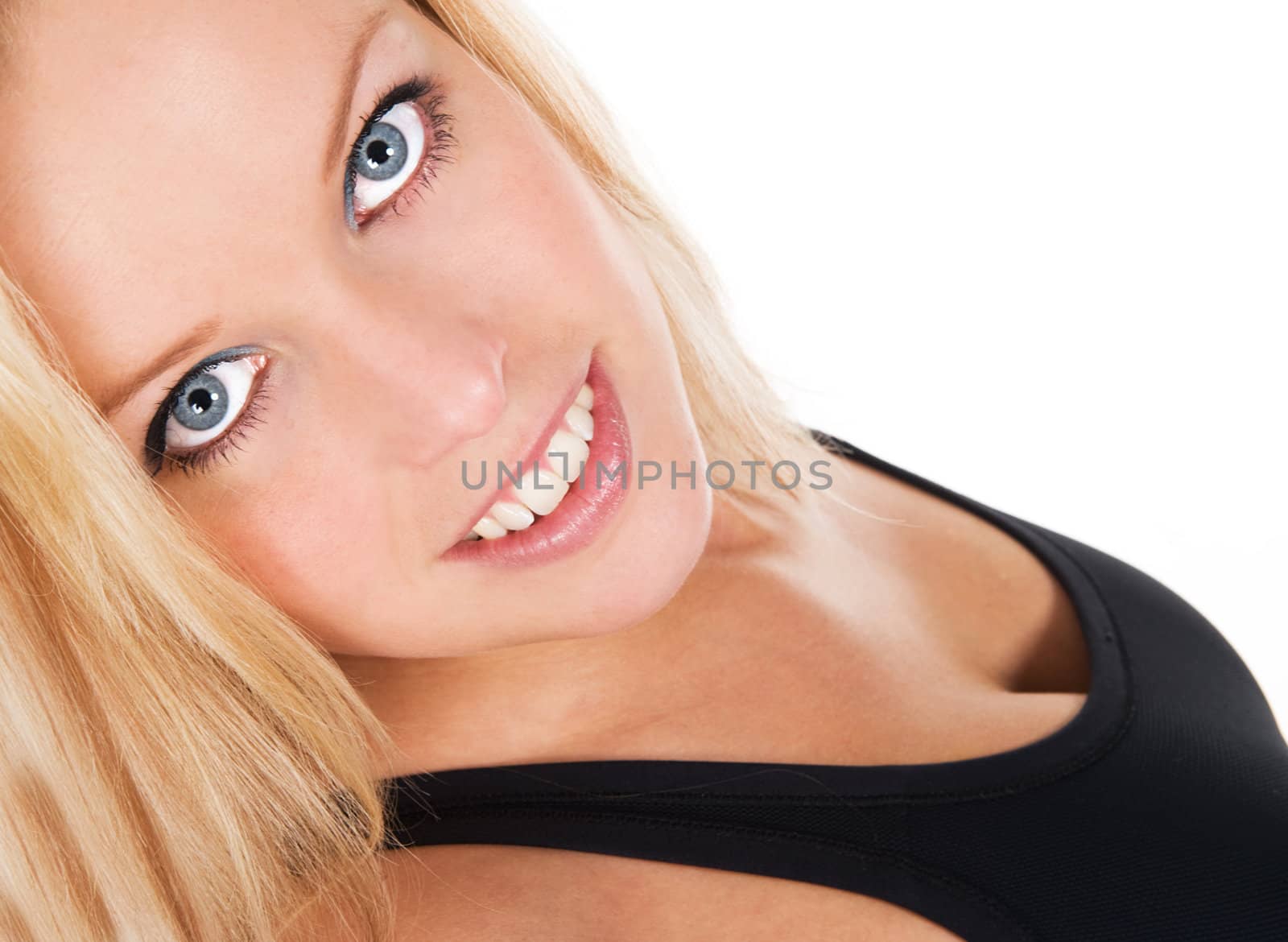 Beautiful blond blue eyed fitness girl, seen against white background