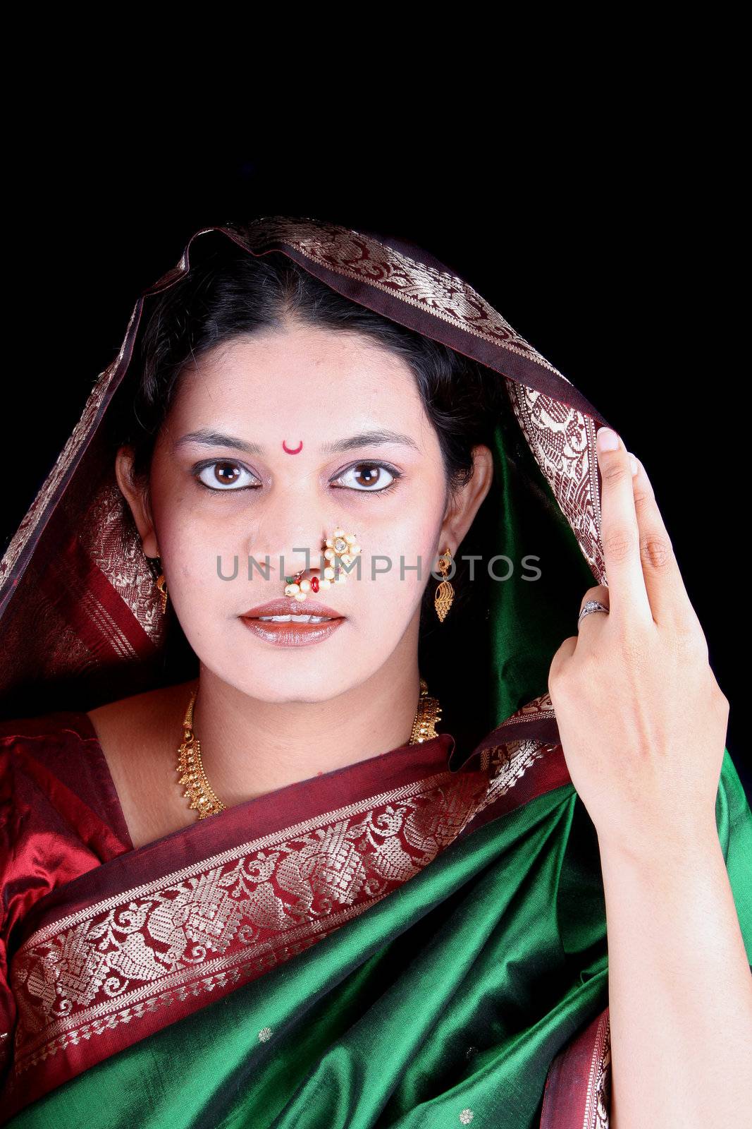 A portrait of a beautiful Marathi Indian woman in a traditional attire.